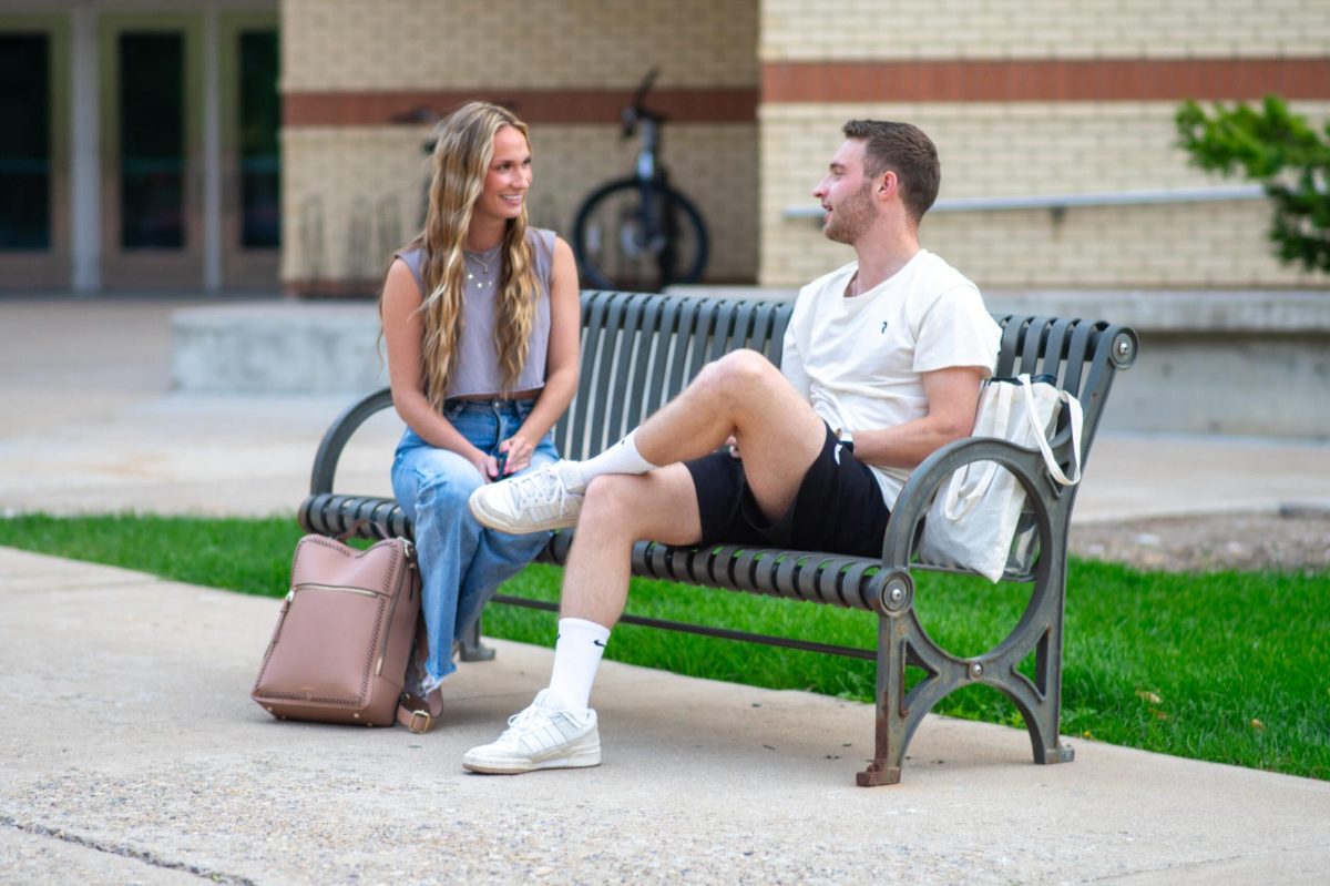 Students chat on the Utah State University campus (photo courtesy of the Utah Statesman)