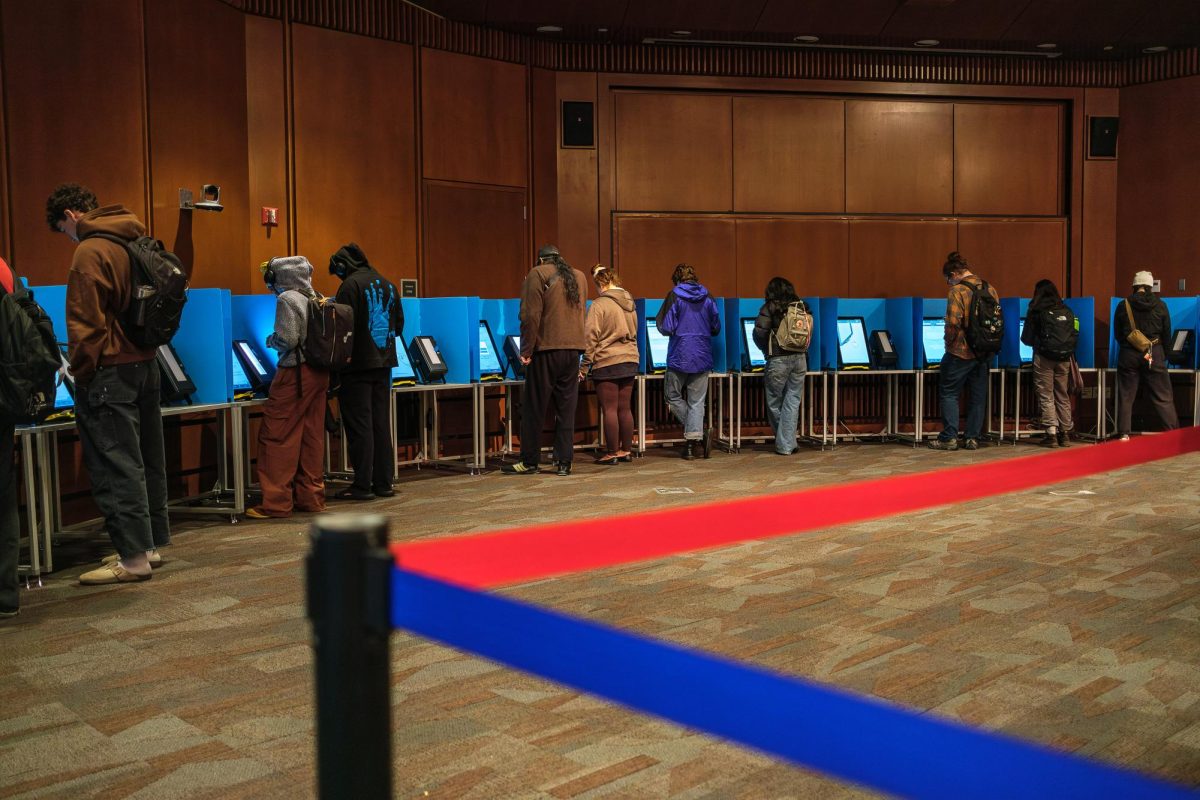 Voters cast their ballots at the J. Willard Marriott Library in Salt Lake City on Tuesday, Nov. 5, 2024. (Photo by Marco Lozzi | The Daily Utah Chronicle)