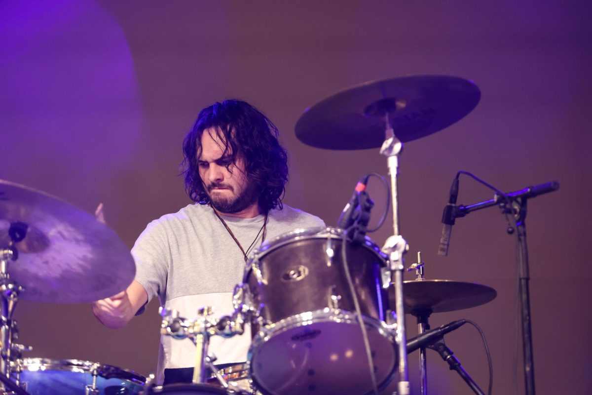 Jackson Price, Drummer for Blue Rain Boots, performs at RedFest at the University of Utah in the A. Ray Olpin Student Union Ballroom in Salt Lake City on Nov. 15, 2024. (Photo by Addy Cowley | The Daily Utah Chronicle)