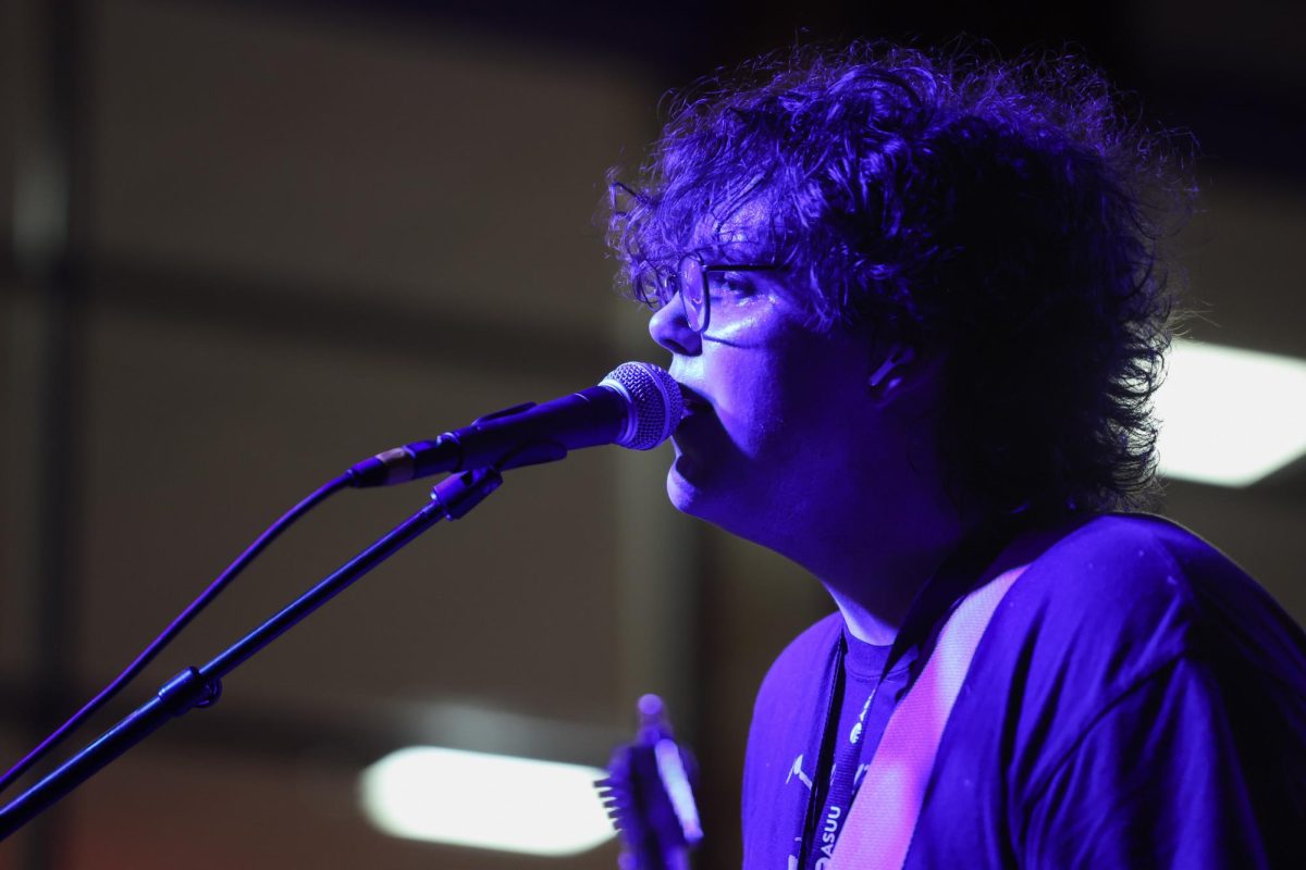 Simon Griffen, lead singer of Blue Rain Boots, performs at RedFest at the University of Utah in the A. Ray Olpin Student Union Ballroom in Salt Lake City on Nov. 15, 2024. (Photo by Addy Cowley | The Daily Utah Chronicle)