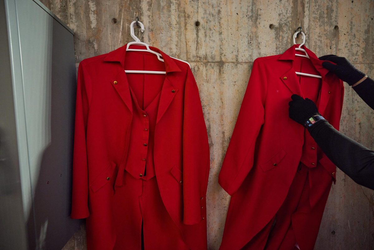 The bright red tailcoats of the 801 pyros are hung between uses during the U vs. BYU game in the Rice-Eccles Stadium on Saturday, Nov. 9, 2024. (Photo by Luke Larsen | The Daily Utah Chronicle)