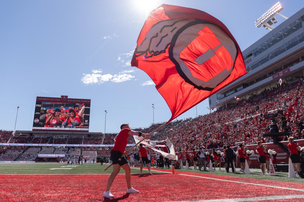 The U spirit team flies a Utah Utes flag at the Rice-Eccles Stadium in Salt Lake City on Saturday, Oct. 14, 2023. (Photo courtesy of The Daily Utah Chronicle archives)