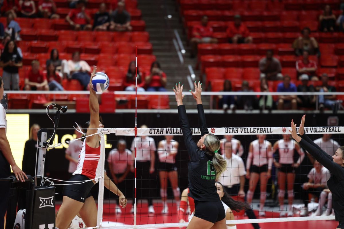 Emrie Moea'i with the kill against UVU at the Huntsman Center on Sept. 9, 2025. (Photo by Sean Stetson | The Daily Utah Chronicle)