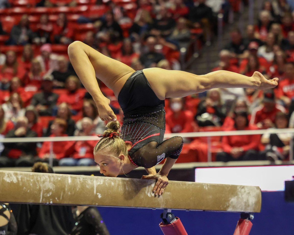 Utah freshman Abbi Ryssman competes on the balance beam during a tri-meet against Minnesota and Iowa at the Jon M. Huntsman Center on Friday, Jan. 2, 2026. (Photo by Sean Stetson | The Daily Utah Chronicle)