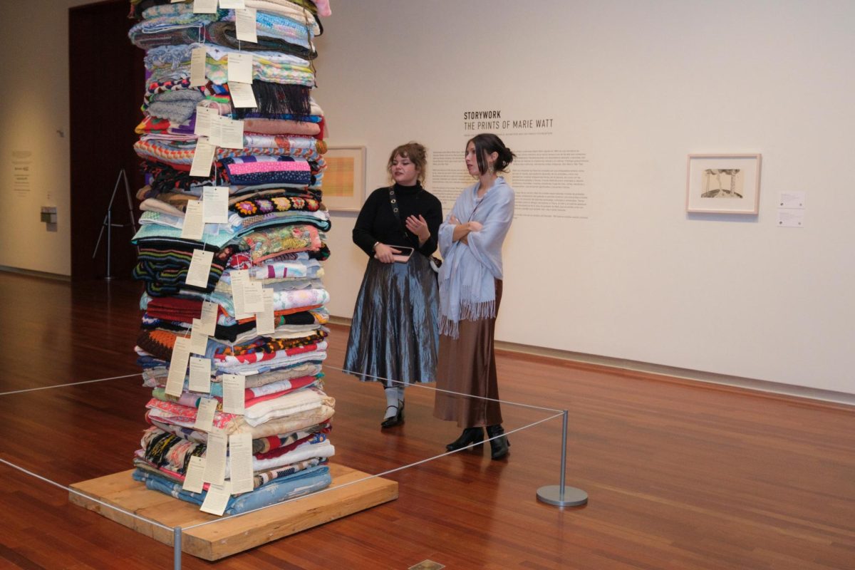 Viewers observe a sculpture by Marie Watt. (Courtesy of Adelaide Ryder)