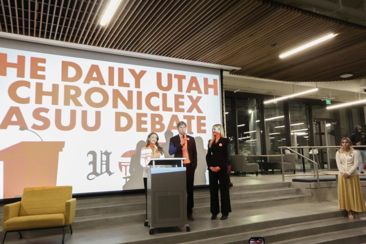 The Stringham Ticket, Erica Stringham, Jake Holmberg and Niya West, present their opening statements at The Daily Utah Chronicle X ASUU Debate on Thursday, Feb. 19, 2026. (Photo by Luca DiGregorio | The Daily Utah Chronicle)
