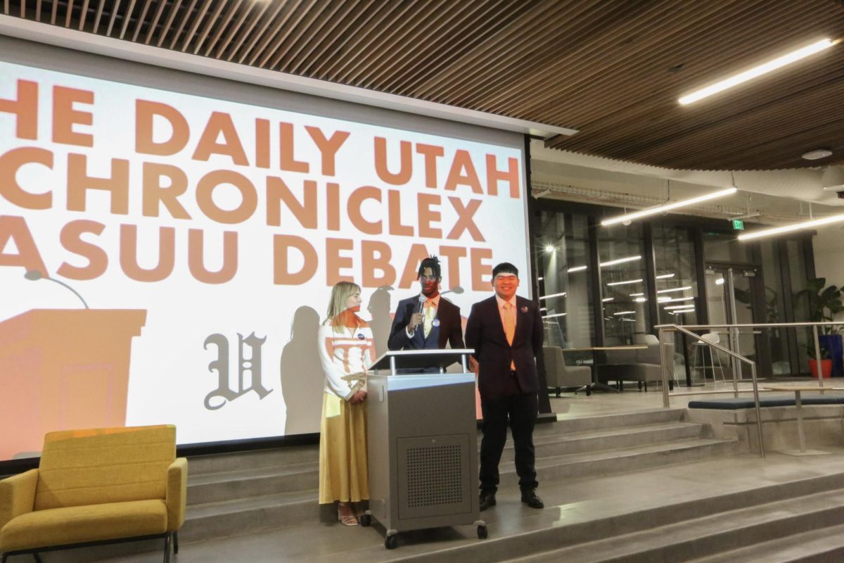 The Sunshine Ticket, Addie Bonney, Ray Baker and Eddie Yakoyama, present their opening statements at The Daily Utah Chronicle X ASUU Debate on Thursday, Feb. 19, 2026. (Photo by Luca DiGregorio | The Daily Utah Chronicle)