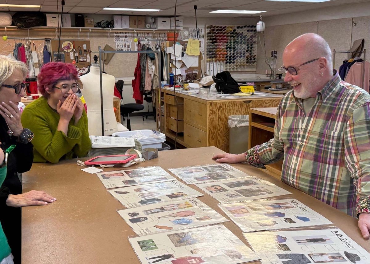 (left to right) Catherine Soucy, Keanna Frodente and Kevin Alberts stand around costume designs in the costume shop of Pioneer Theatre Company. (Courtesy of Joshua Black)