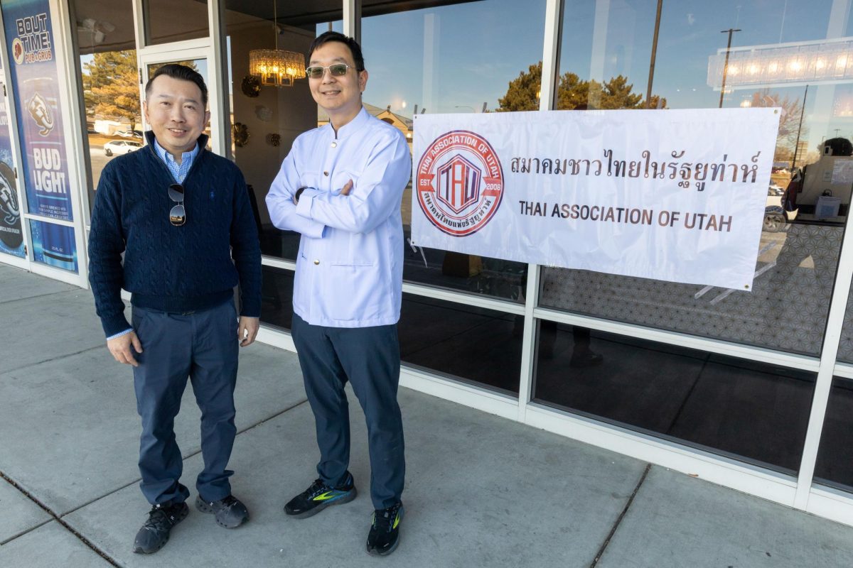 Dr. Navaravong, president of the Thai Association of Utah and Kijvekin, Simply Thai owner and Thai Association of Utah vice president, welcome customers to the Thai Association of Utah’s Thai Market, in Sandy, Utah, on Thursday, Jan. 22. 2026. (Photo by Luke Larsen | The Daily Utah Chronicle)