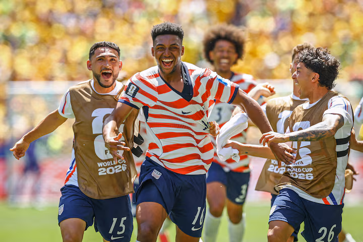 Alex Freeman of the U.S. celebrates scoring their second goal with Cristian Roldan and Alex Zendejas. REUTERS/Albert Gea