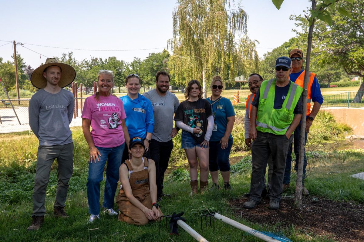 Members and volunteers help clear a river for Habitat for Humanity Pride Build at Fitts Park in Salt Lake City on Tuesday, June 23, 2026. (Photo by Kristina Walker | The Daily Utah Chronicle)