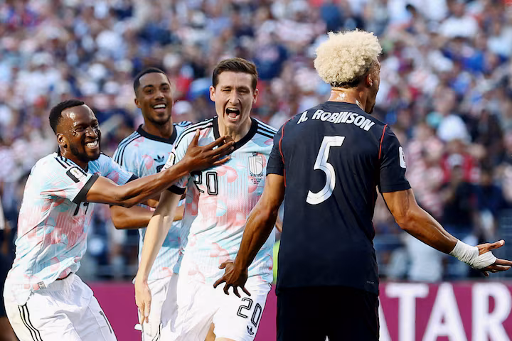 Belgium's Hans Vanaken celebrates scoring the team's third goal with Dodi Lukebakio and Youri Tielemans as Antonee Robinson of the U.S. reacts, July 6.