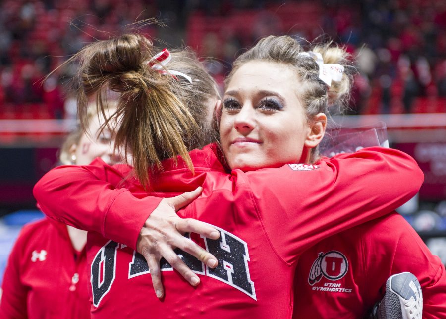 The University of Utah Womens Gymnastics junior Tiffani Lewis hugs senior Baely Rowe after the meet with Stanford at the John M. Huntsman Center on Friday, March 3, 2017 (Kiffer Creveling | The Daily Utah Chronicle)